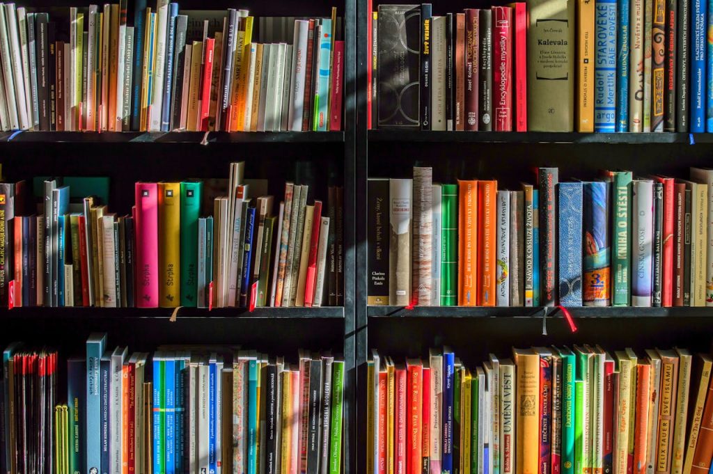 Home Vibrant collection of books on shelves for reading, research, and education.
